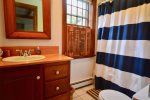 Main level twin room ensuite full bathroom with tub/shower